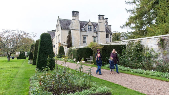 A family walk in the garden at Nunnington Hall in late autumn